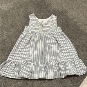 Light weight striped summer dress with button detail.